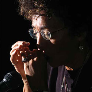 Jackie Merritt playing the harmonica