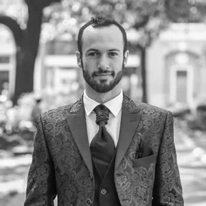 William Nemitoff received his Master of Architecture degree from Tulane University in New Orleans, Louisiana. William stands wearing a suit in this black and white photo.